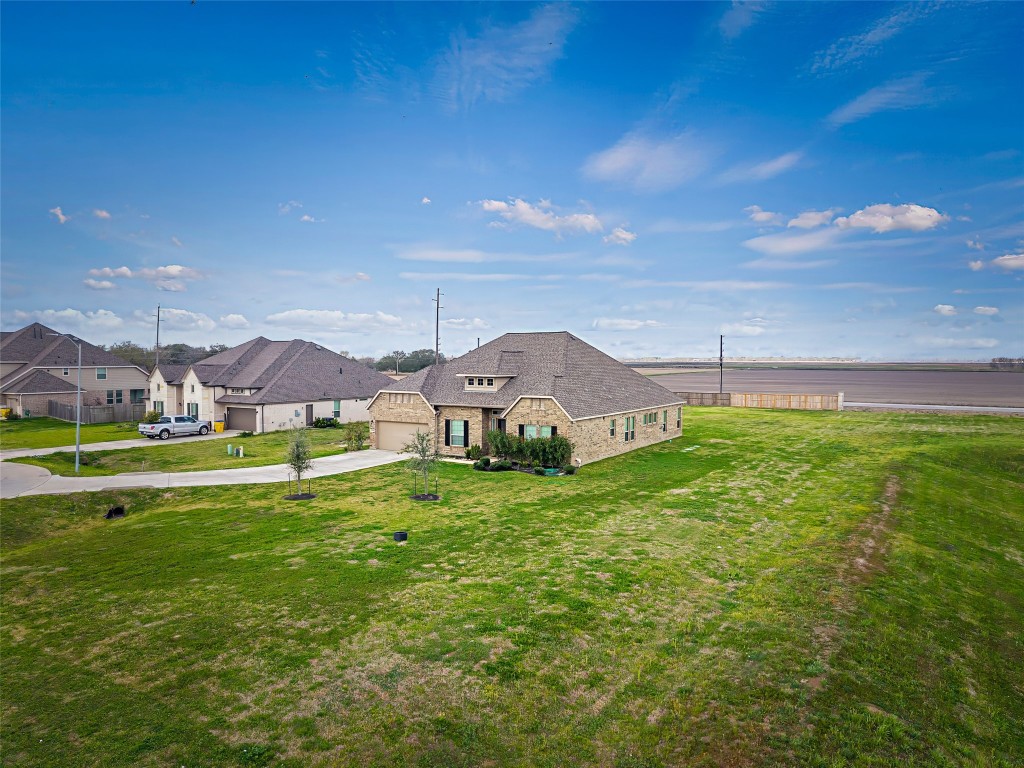 11202 Seguin Trail Needville, TX 77461 - Photo 30 of 31 a view of a house with a yard and a fountain