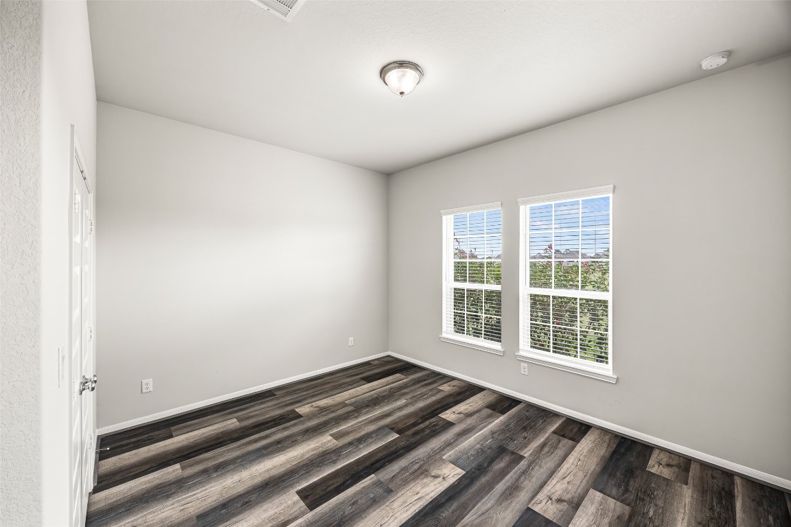11202 Seguin Trail Needville, TX 77461 - Photo 6 of 31 a view of a room with wooden floor and windows