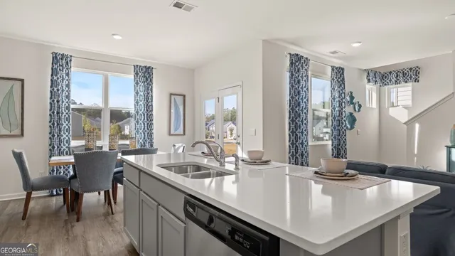 a view of kitchen island a sink and living room