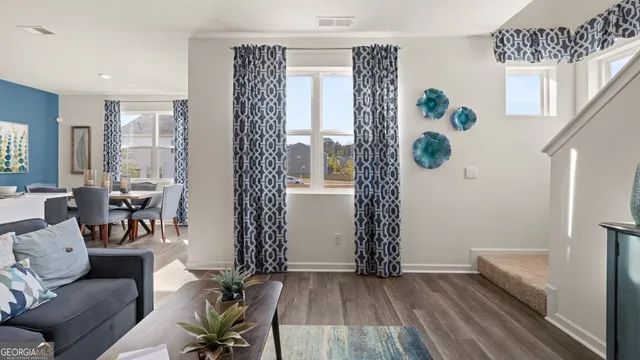 a living room with furniture and a window