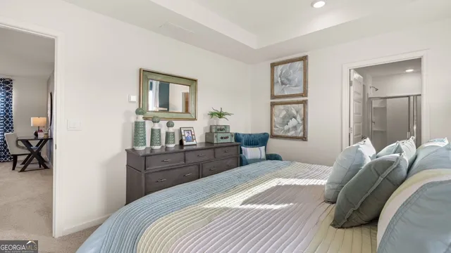 a bedroom with a bed and furniture