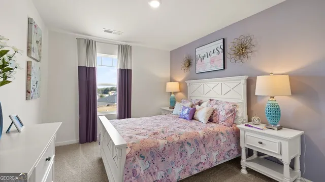 a bedroom with a bed and a couch