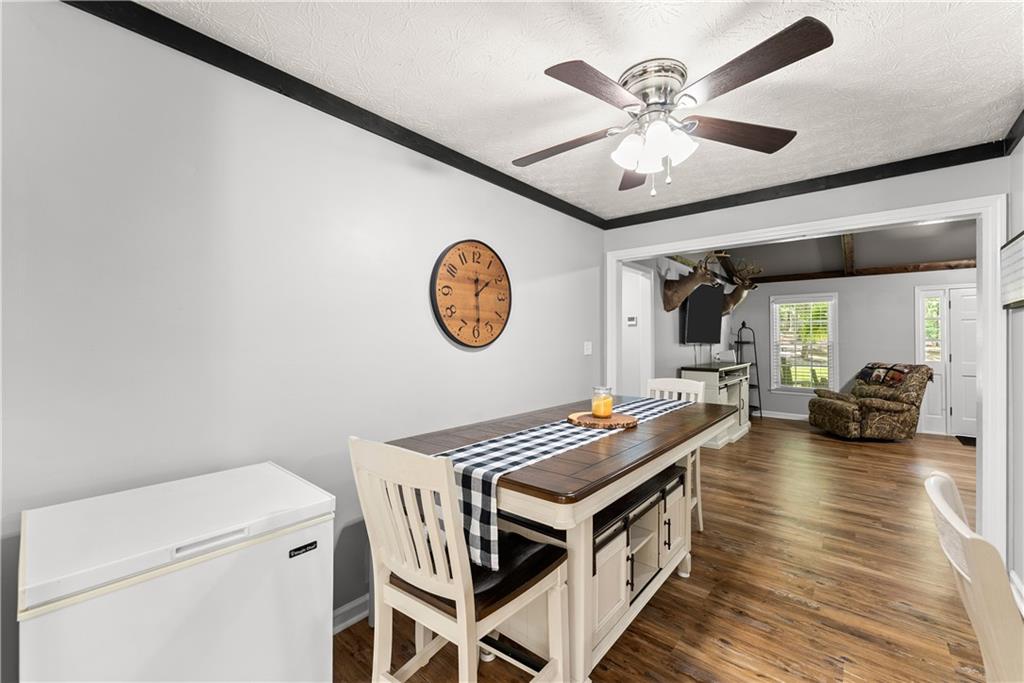 1405 Tapp Wood Road Hoschton, GA 30548 - Photo 16 of 44 a view of a kitchen with a stove and a clock