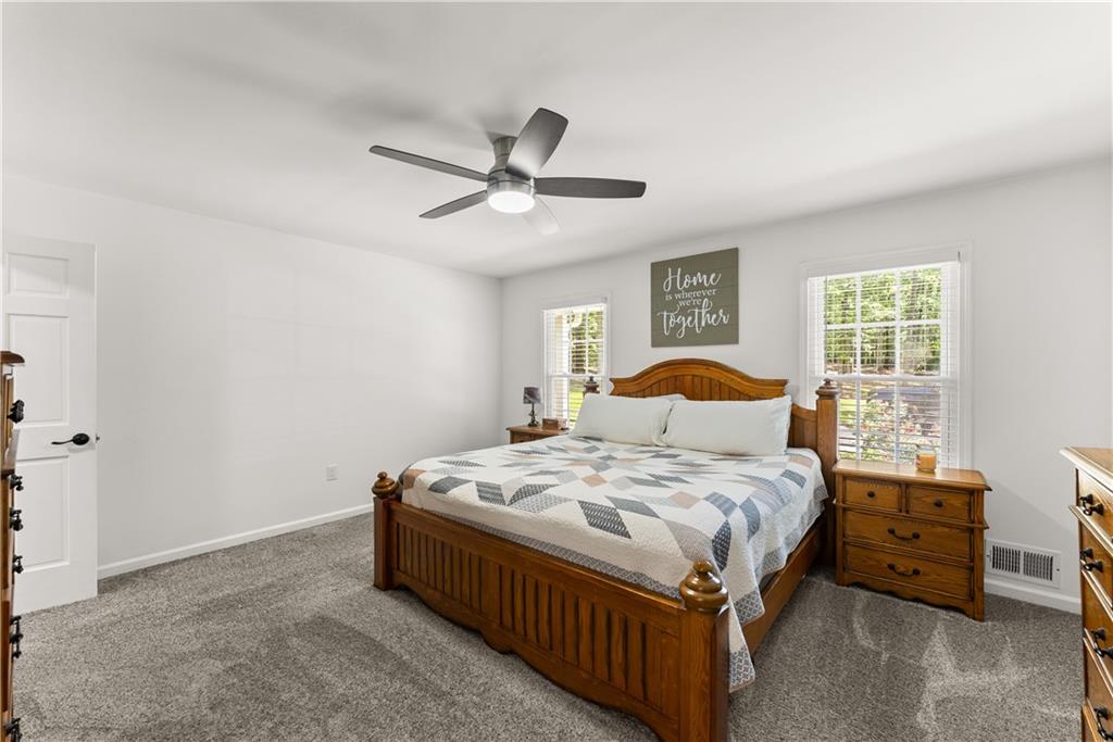 1405 Tapp Wood Road Hoschton, GA 30548 - Photo 22 of 44 a bedroom with a bed and window