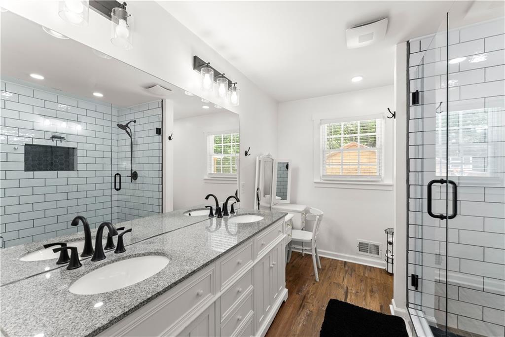 1405 Tapp Wood Road Hoschton, GA 30548 - Photo 26 of 44 a bathroom with a granite countertop sink mirror and double
