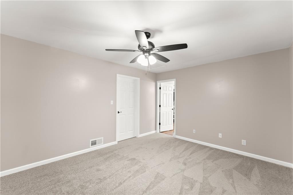 1405 Tapp Wood Road Hoschton, GA 30548 - Photo 32 of 44 a view of a chandelier fan in a room