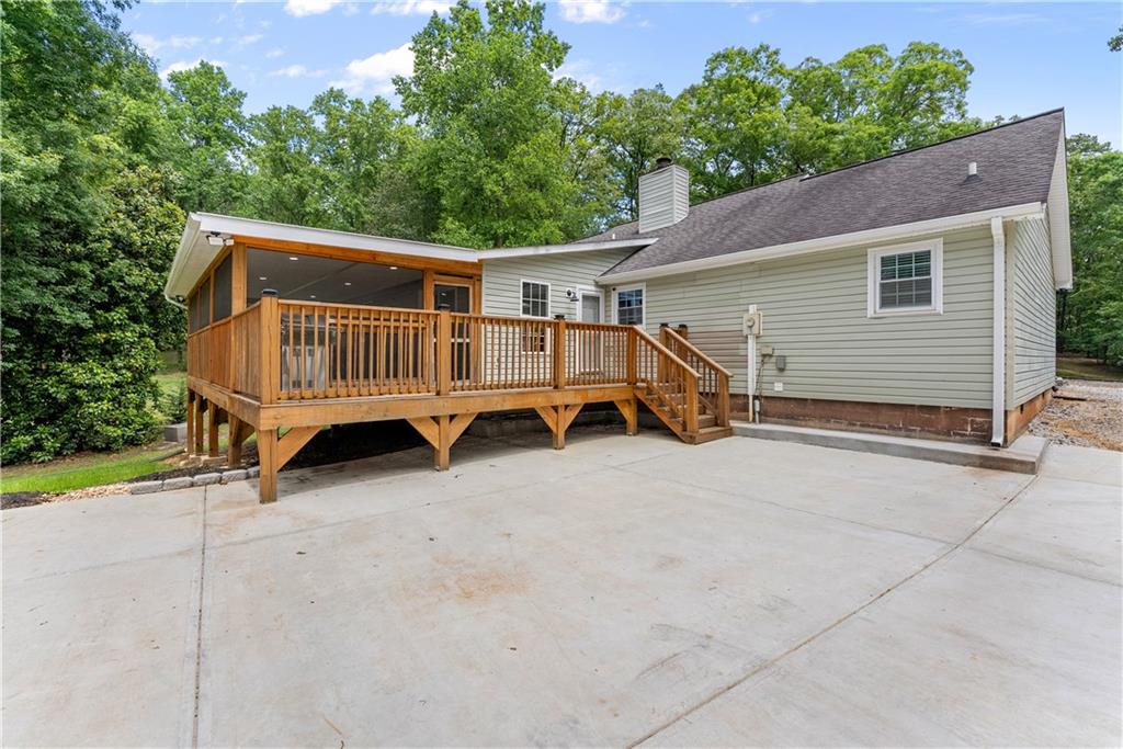 1405 Tapp Wood Road Hoschton, GA 30548 - Photo 34 of 44 a view of a house with a yard and wooden fence