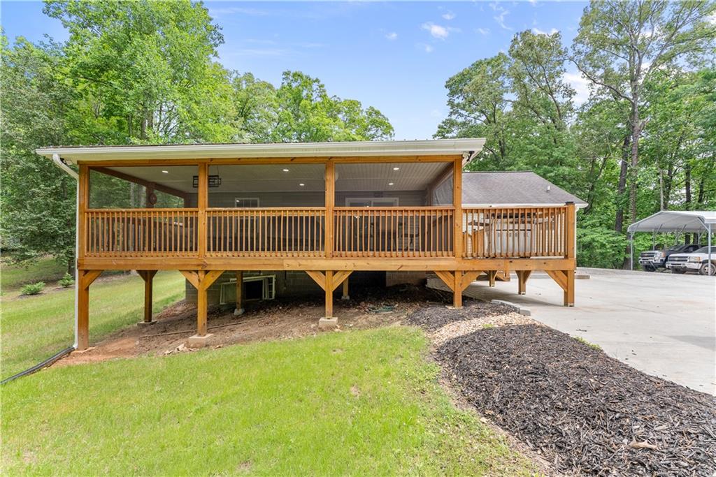 1405 Tapp Wood Road Hoschton, GA 30548 - Photo 35 of 44 a view of a house with backyard porch and sitting area
