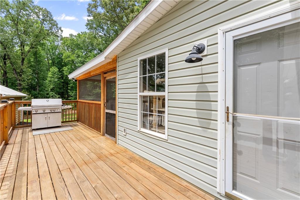 1405 Tapp Wood Road Hoschton, GA 30548 - Photo 38 of 44 a view of a house with a deck