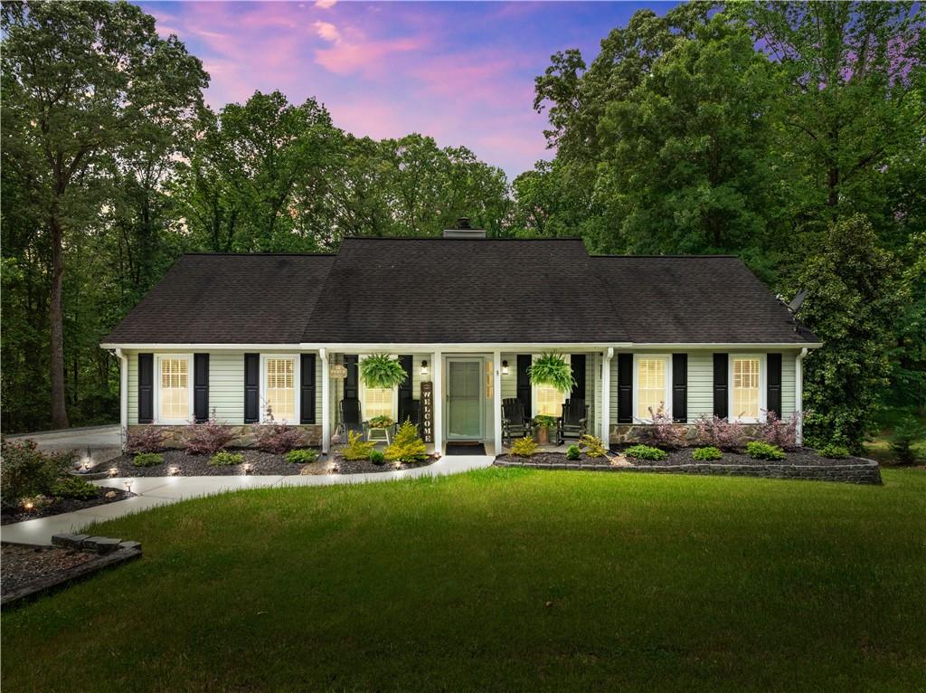 1405 Tapp Wood Road Hoschton, GA 30548 - Photo 5 of 44 a front view of house with yard and green space