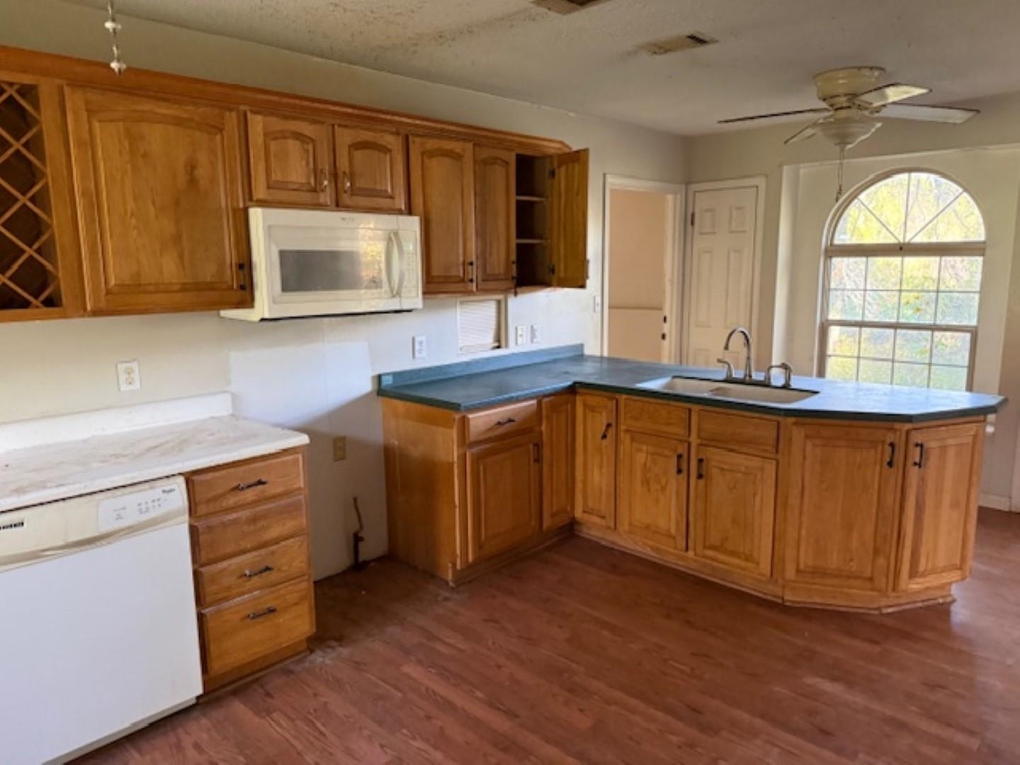 11035 Avery Road West Frankfort, IL 62896 - Photo 3 of 11 a kitchen with stainless steel appliances granite countertop a sink a stove cabinets and wooden floor