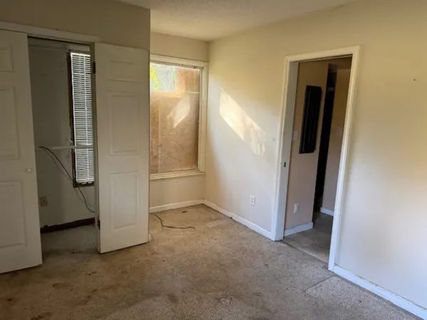 an empty room with closet
