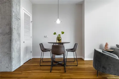 a large bed sitting in a bedroom next to a window