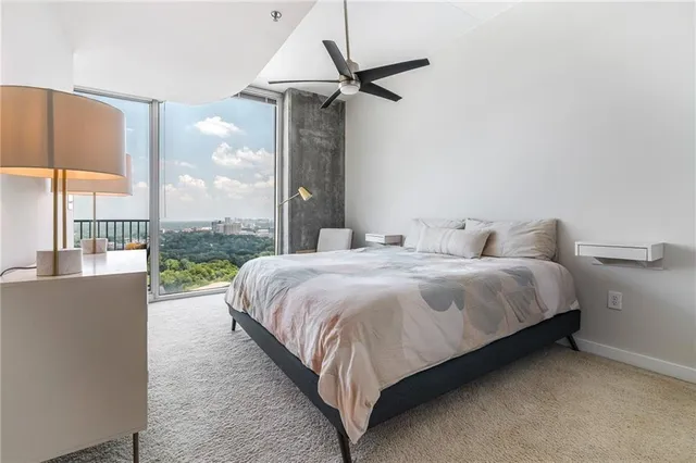 a bathroom with a granite countertop sink a toilet and a bathtub