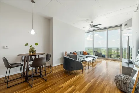a living room with furniture and a flat screen tv