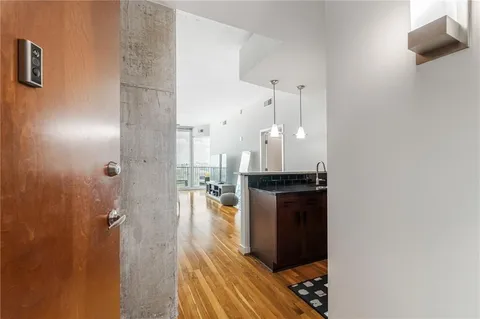 a kitchen with stainless steel appliances granite countertop a sink a stove and a refrigerator