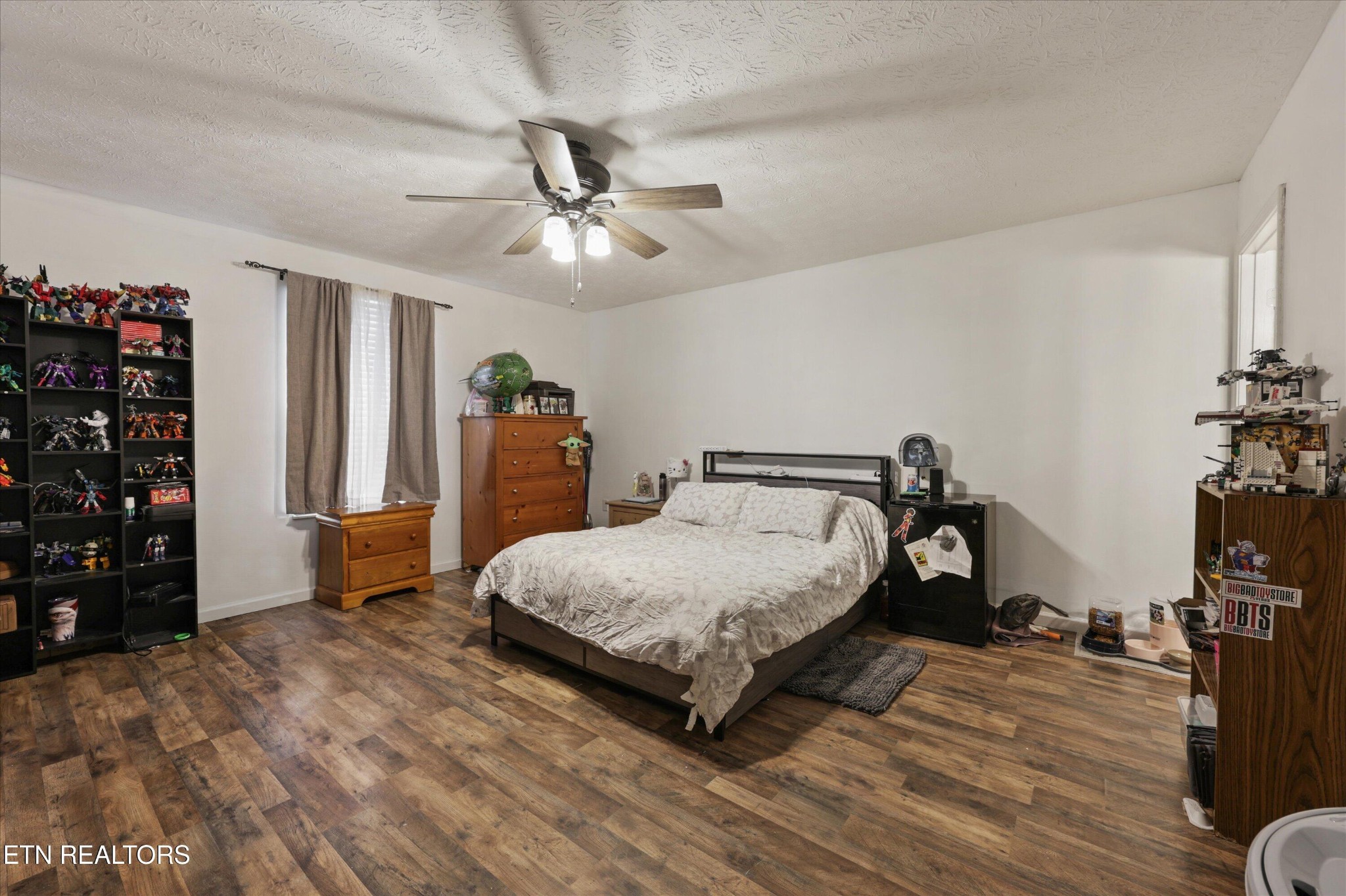 1306 Tabitha Drive White Pine, TN 37890 - Photo 12 of 31 a bedroom with a bed closet and a flat tv screen