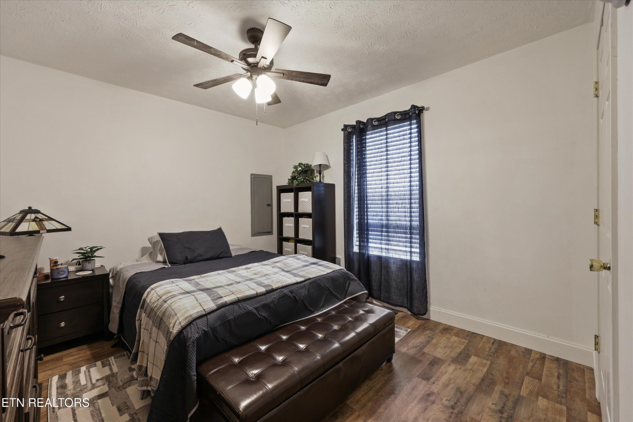 1306 Tabitha Drive White Pine, TN 37890 - Photo 13 of 31 a bedroom with a bed and a chandelier