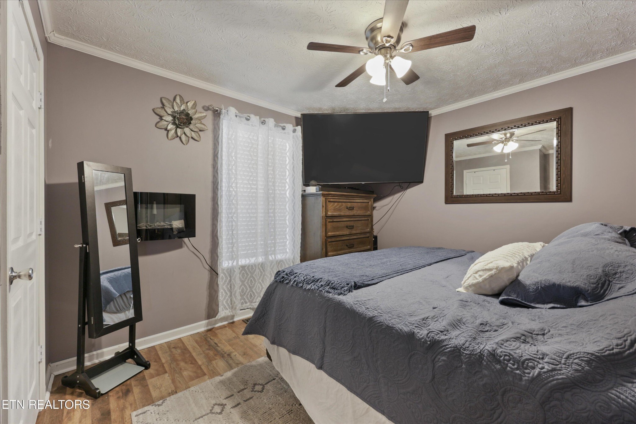 1306 Tabitha Drive White Pine, TN 37890 - Photo 14 of 31 a bedroom with a bed and a flat screen tv