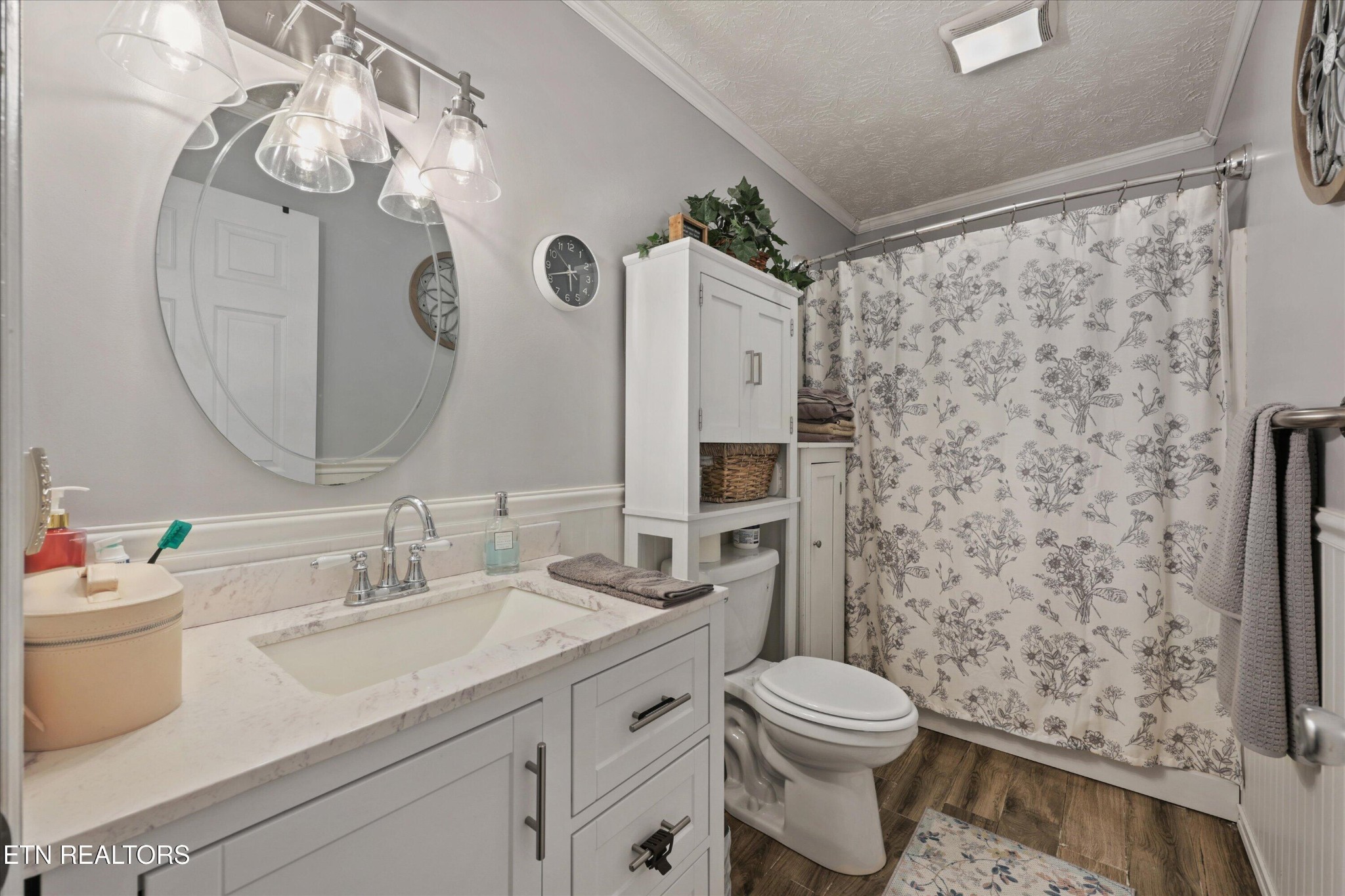 1306 Tabitha Drive White Pine, TN 37890 - Photo 16 of 31 a bathroom with a sink a toilet and shower curtain