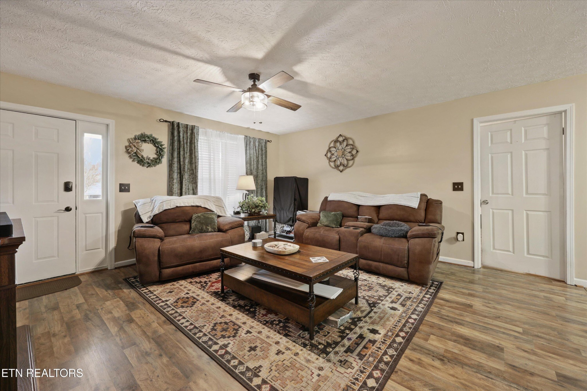 1306 Tabitha Drive White Pine, TN 37890 - Photo 6 of 31 a living room with furniture a clock and a wooden floor