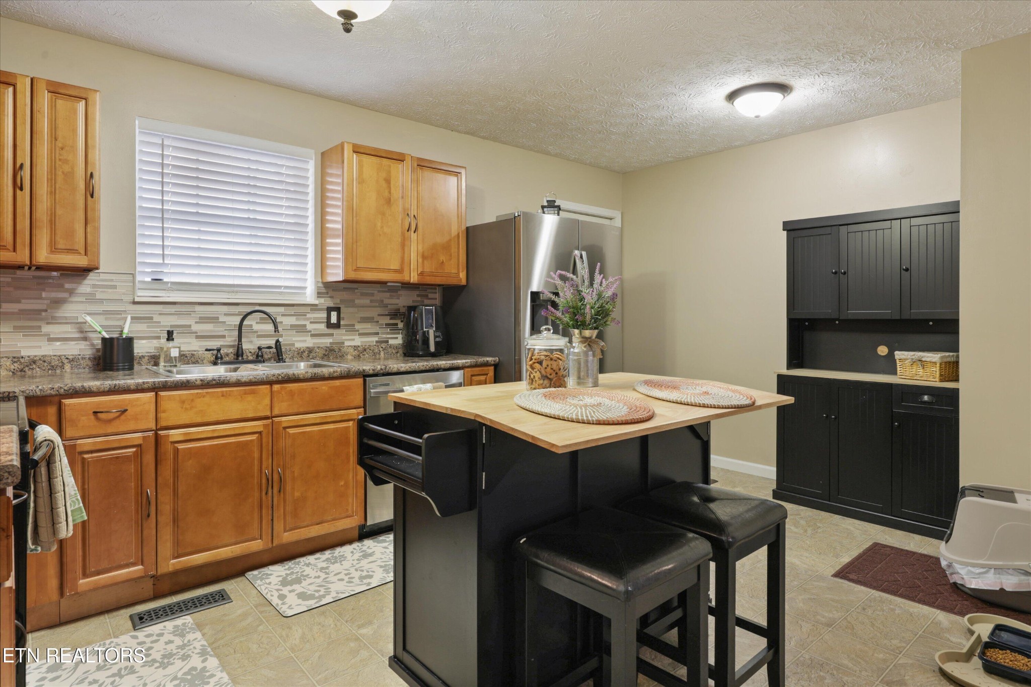 1306 Tabitha Drive White Pine, TN 37890 - Photo 8 of 31 a kitchen with a sink cabinets and dining table