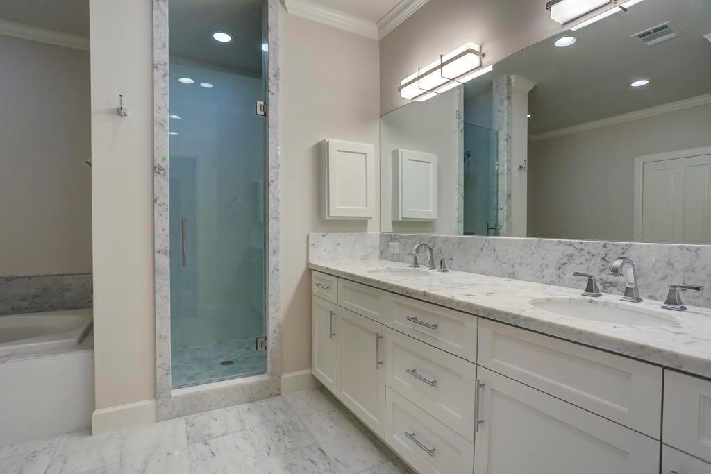 1522 Dunlavy Street, Unit B Houston, TX 77006 - Photo 11 of 16 a bathroom with a double vanity sink and a mirror