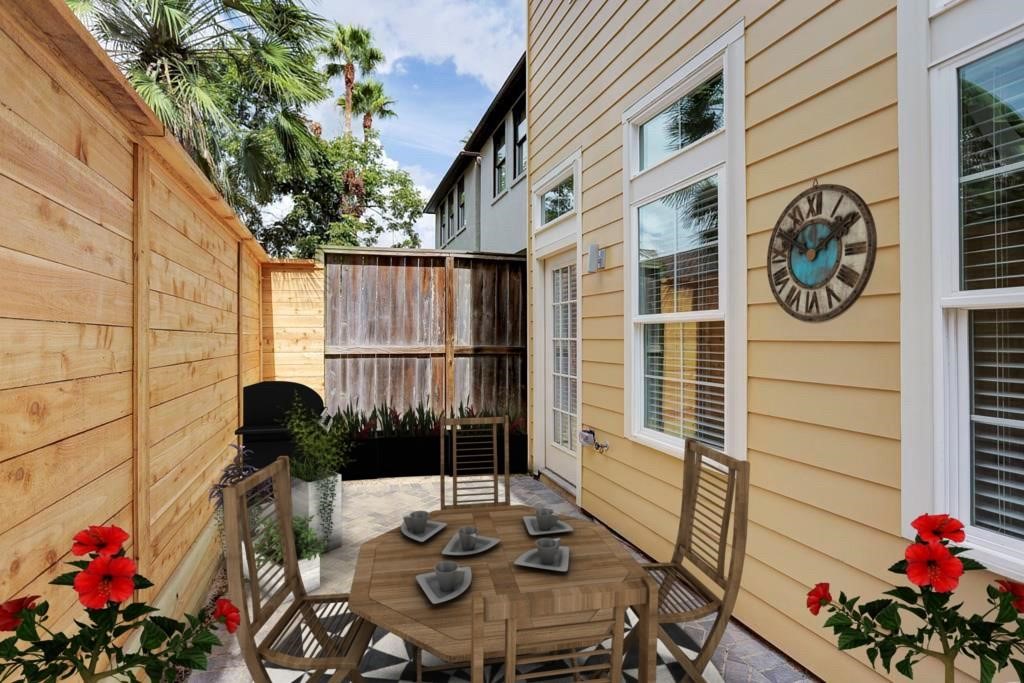 1522 Dunlavy Street, Unit B Houston, TX 77006 - Photo 5 of 16 a front view of a house with chairs