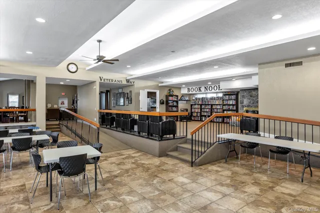 a living room with lots of furniture and white walls