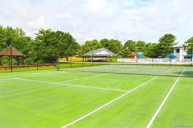 a view of an outdoor space and tennis court