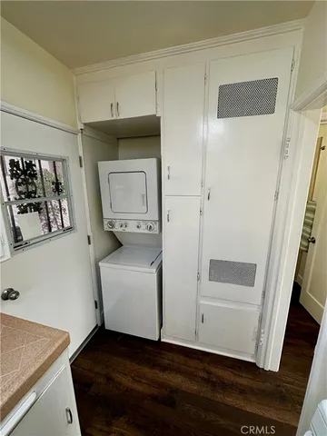 a white stove top oven sitting inside of a kitchen