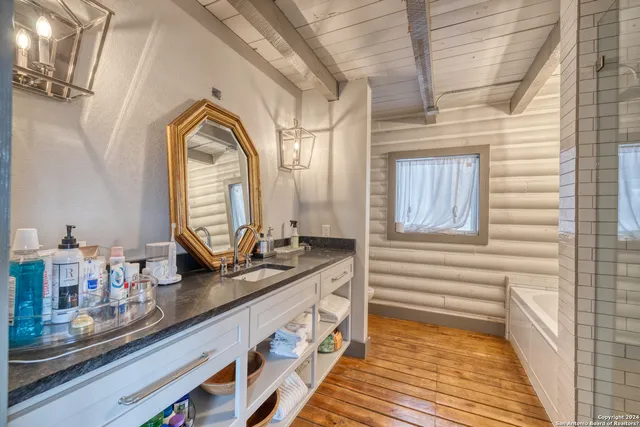 a bathroom with a sink and a mirror