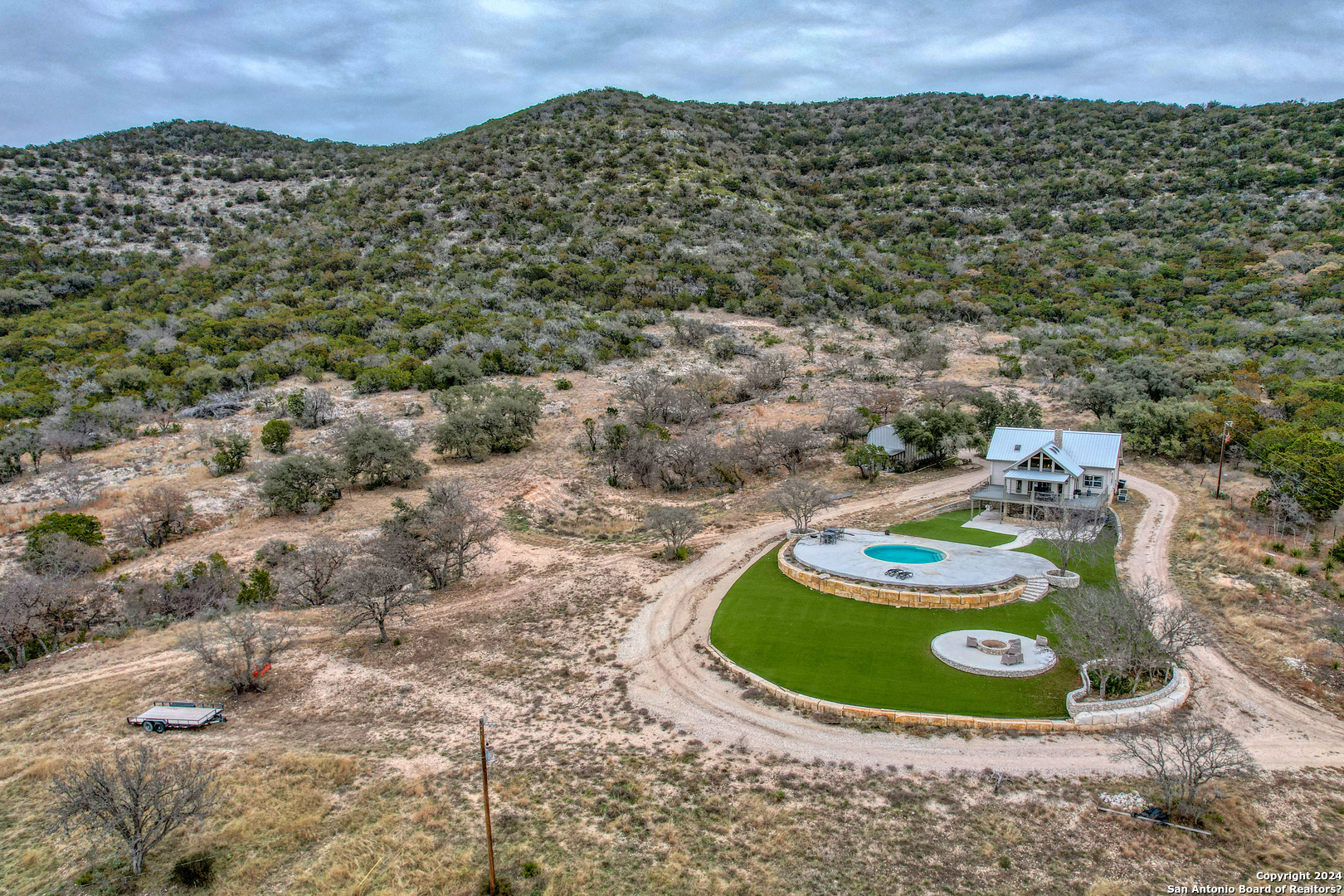 254 North Fork Bonner Road Leakey, TX 78873 - Photo 2 of 47 a view of a swimming pool with a yard