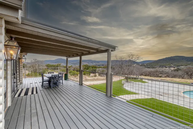 a view of a swimming pool with a lounge chair