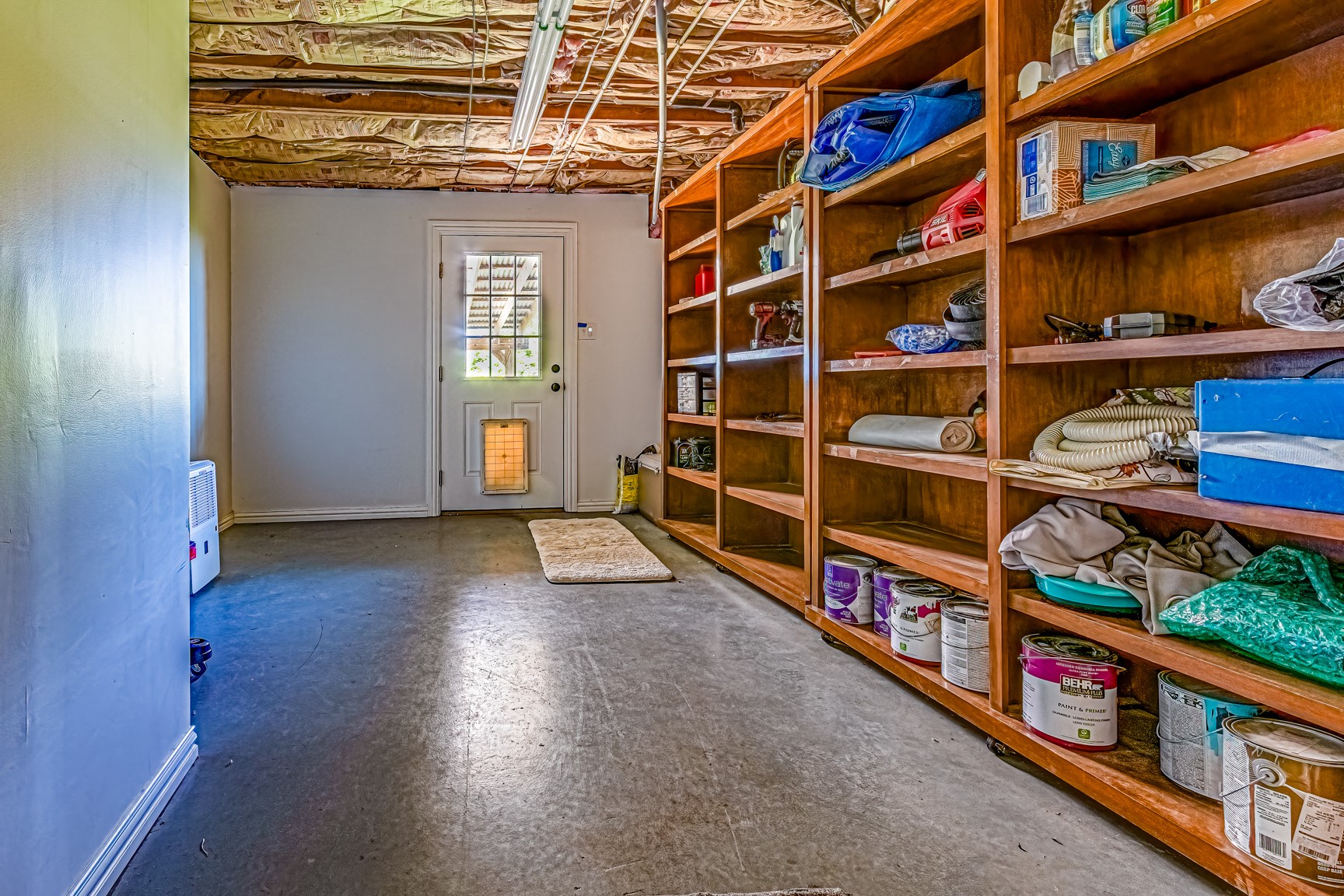 480 Johnson Road Coldspring, TX 77331 - Photo 42 of 49 Downstairs storage and utility room enters from outside into the downstairs hallway.