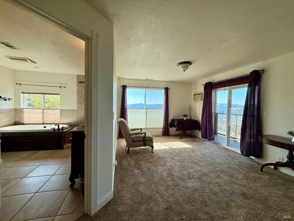 a view of a livingroom with furniture and windows