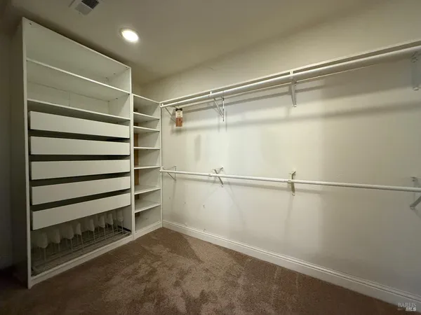 a view of an empty walk in closet