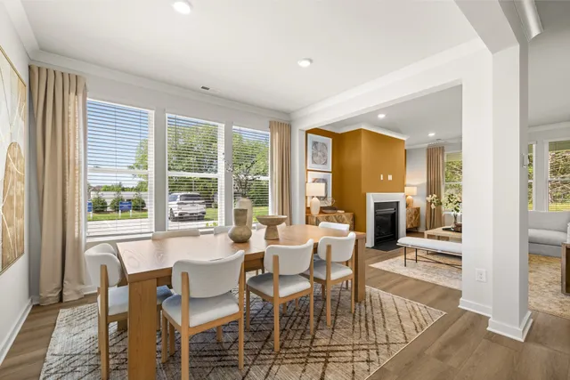 a living room with furniture fireplace and window