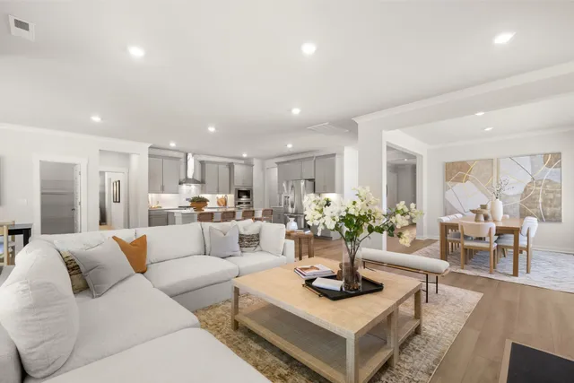 a kitchen with a refrigerator and white countertops
