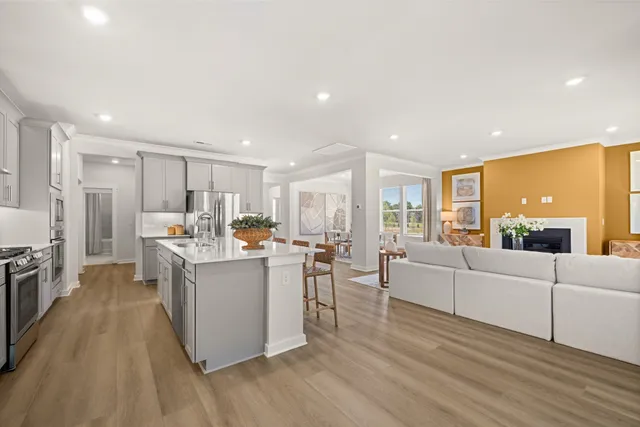 a bedroom with a bed and large windows