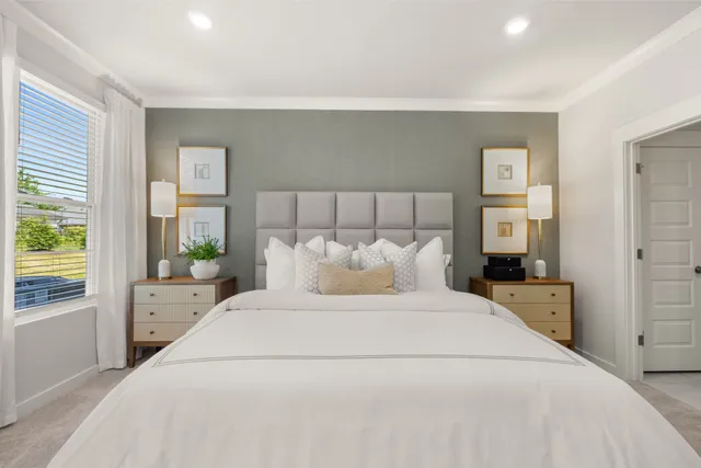 a bedroom with a bed and a dresser