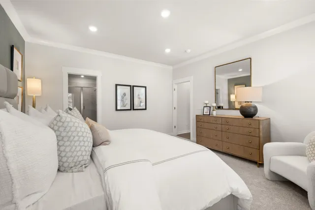 a bathroom with a shower sink and mirror