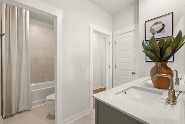 a bathroom with a shower and a bath tub