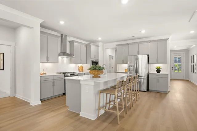 a large kitchen with stainless steel appliances lots of counter space and window