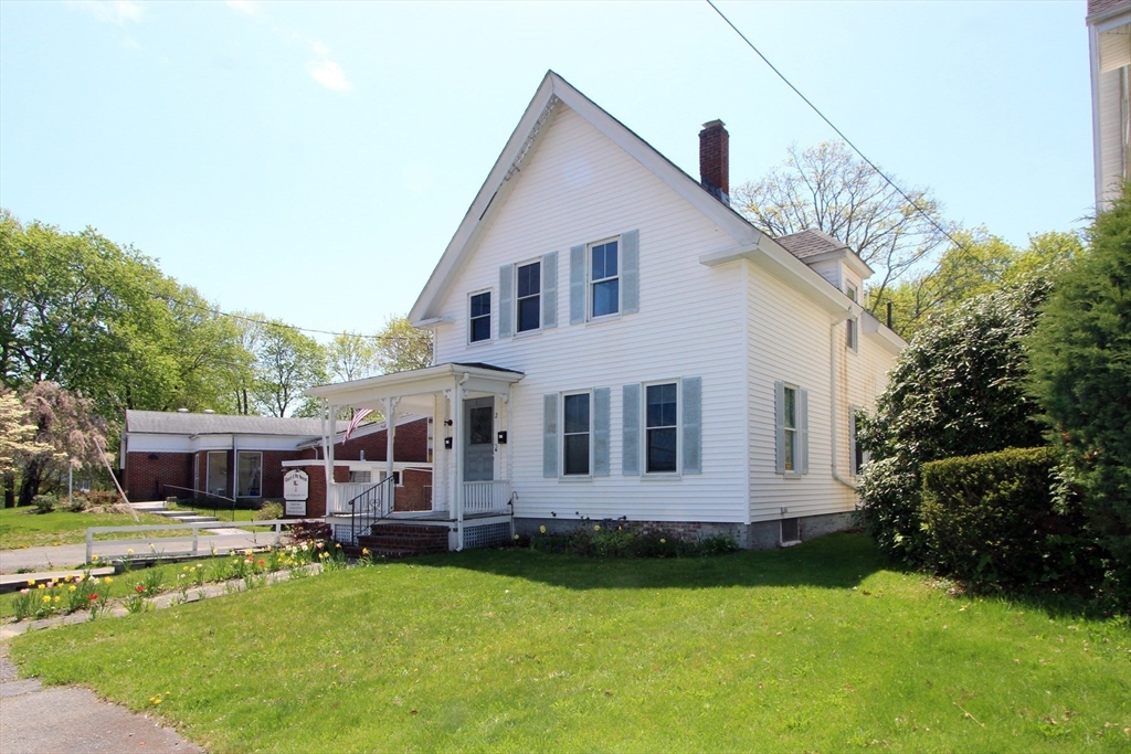 a view of a house with a yard patio and a swimming pool