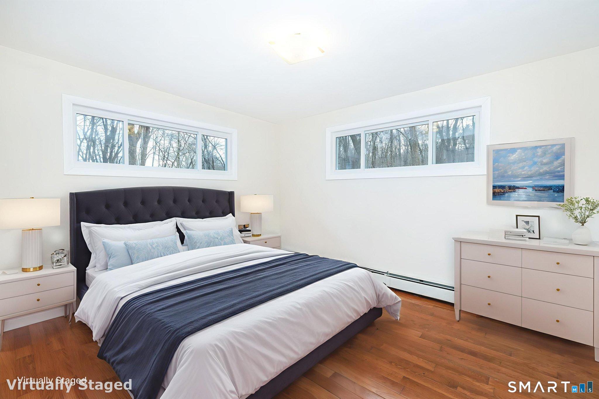 461 Pond Road Franklin, CT 06254 - Photo 14 of 35 a bedroom with a bed and a window