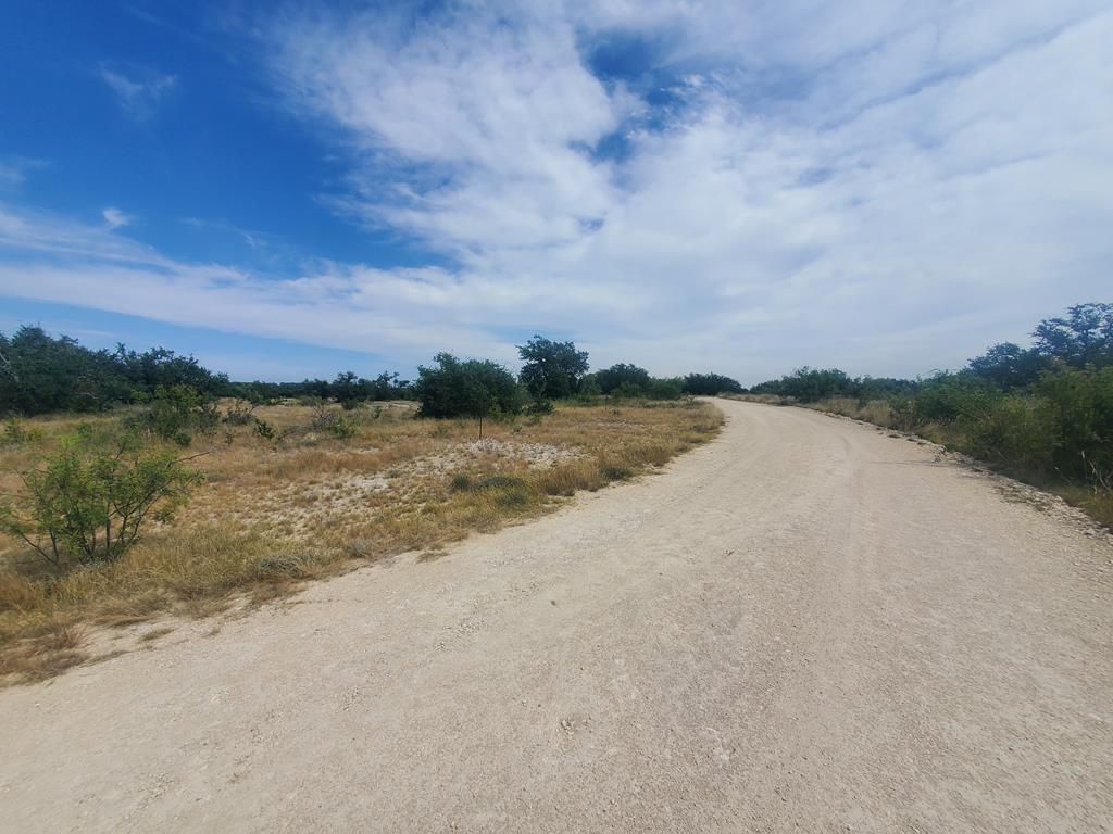 3 Axis Trail, Unit 3 Fort McKavett, TX 76841 - Photo 1 of 12 a view of a lake with houses in the back