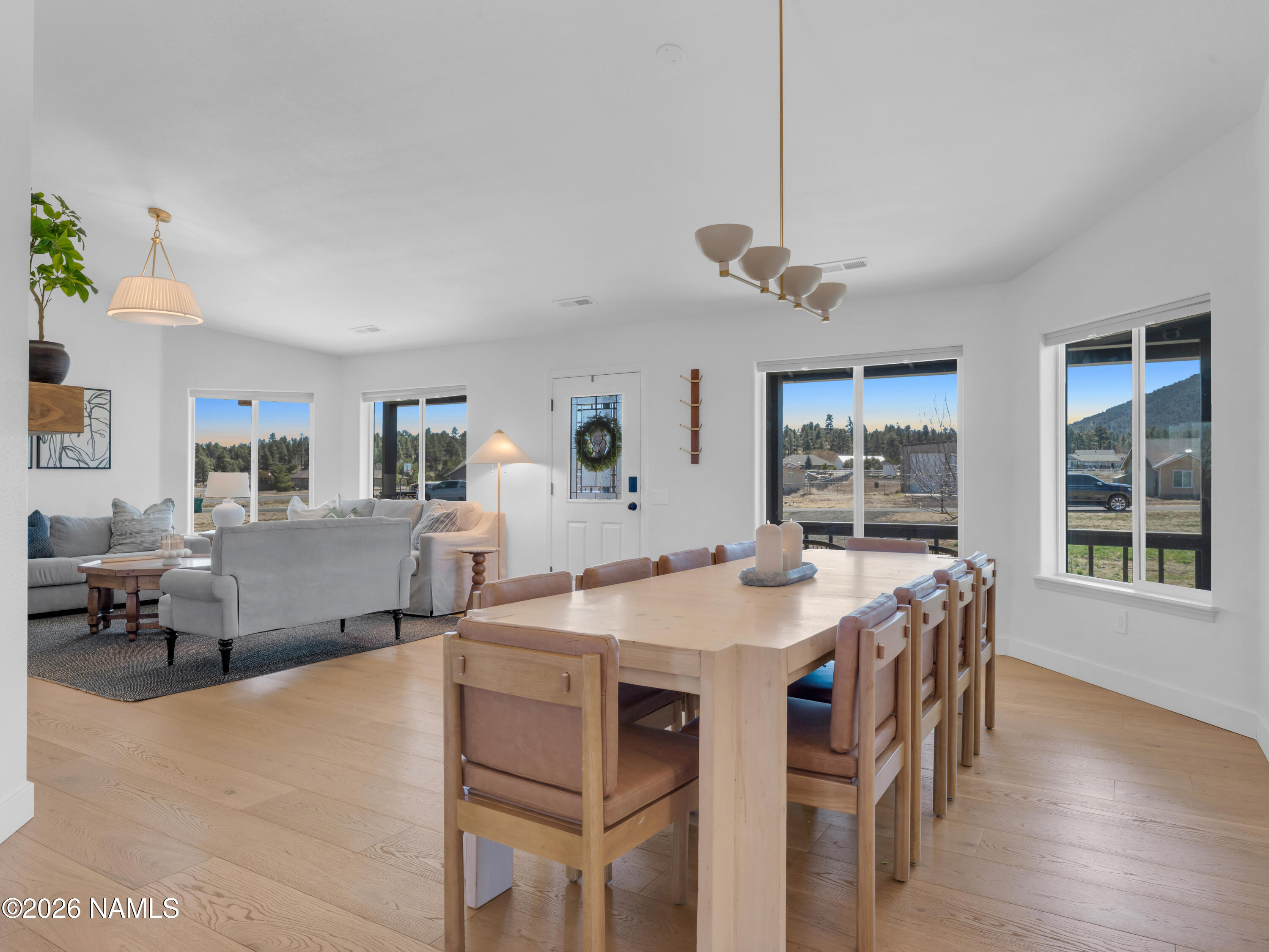 8115 Fawn Run Road Flagstaff, AZ 86004 - Photo 12 of 26 a view of a dining room with furniture window and wooden floor