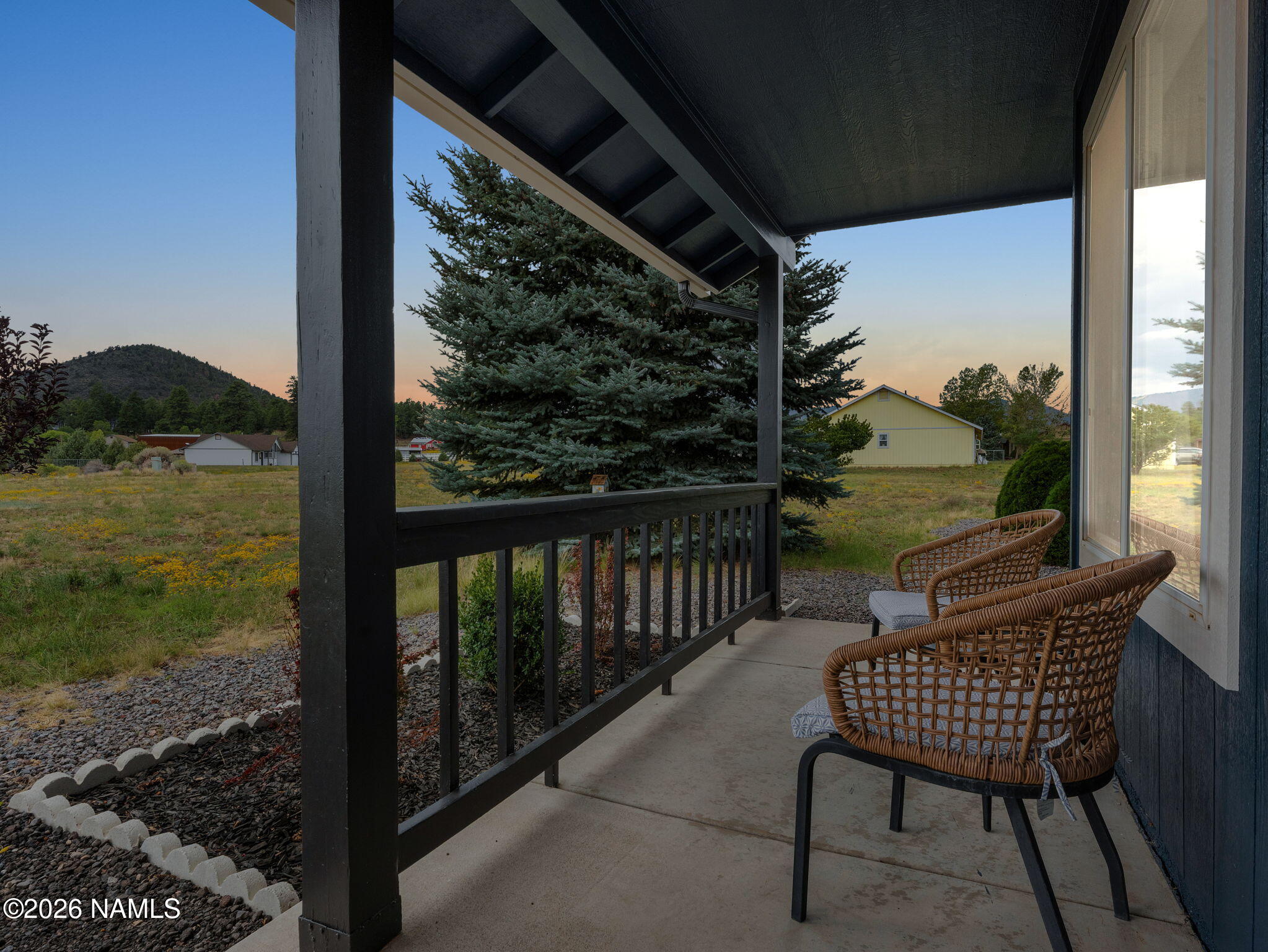 8115 Fawn Run Road Flagstaff, AZ 86004 - Photo 20 of 26 a view of a chair and table in the balcony