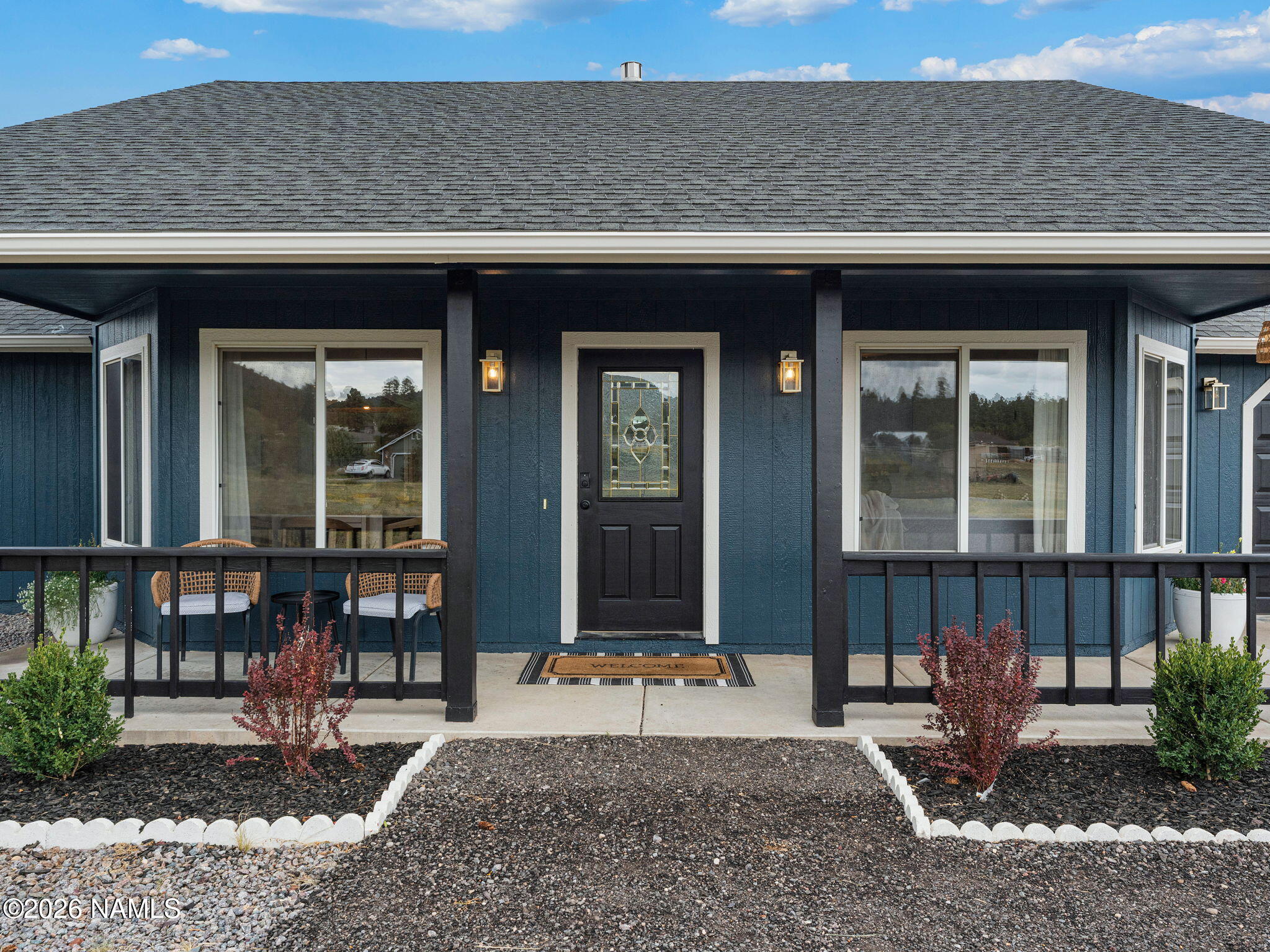8115 Fawn Run Road Flagstaff, AZ 86004 - Photo 2 of 26 a front view of a building with glass windows